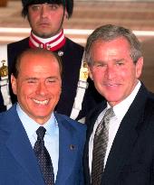 Bush received by Berlusconi in Genoa